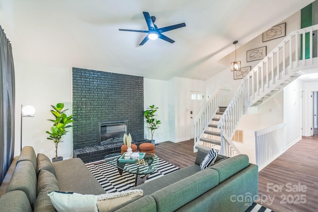 52 Reynolda Dr, Asheville, NC 28803 - living area with wood finished floors, stairway, a ceiling fan, a brick fireplace, and baseboards