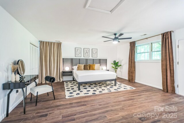 52 Reynolda Dr, Asheville, NC 28803 - bedroom with wood finished floors, attic access, baseboards, and ceiling fan