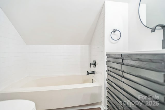 52 Reynolda Dr, Asheville, NC 28803 - full bathroom featuring vaulted ceiling, toilet, and a bathtub