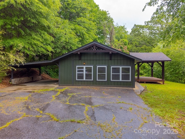 16 Arkansas Trl, Cullowhee, NC 28723 - view of front of property with board and batten siding and driveway