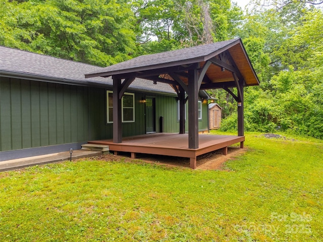 16 Arkansas Trl, Cullowhee, NC 28723 - wooden deck with a storage unit, an outdoor structure, and a lawn