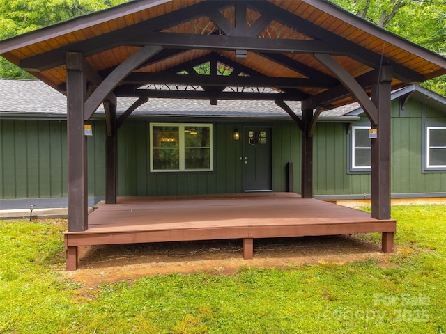 16 Arkansas Trl, Cullowhee, NC 28723 - rear view of property with board and batten siding, a shingled roof, a lawn, and a porch