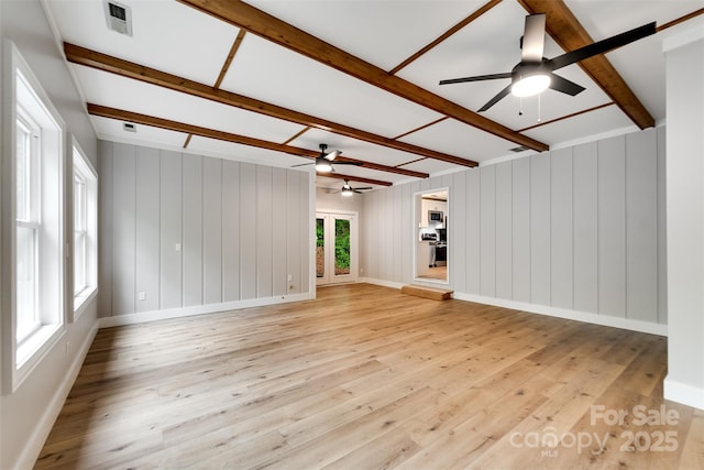 16 Arkansas Trl, Cullowhee, NC 28723 - unfurnished living room with ceiling fan, beamed ceiling, light wood finished floors, and baseboards