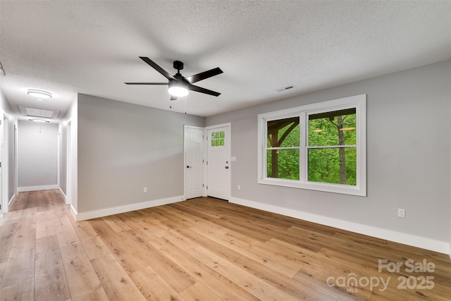 16 Arkansas Trl, Cullowhee, NC 28723 - entryway featuring a textured ceiling, baseboards, light wood-style floors, and ceiling fan