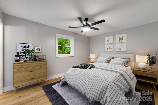 16 Arkansas Trl, Cullowhee, NC 28723 - bedroom featuring baseboards, light wood finished floors, and a ceiling fan