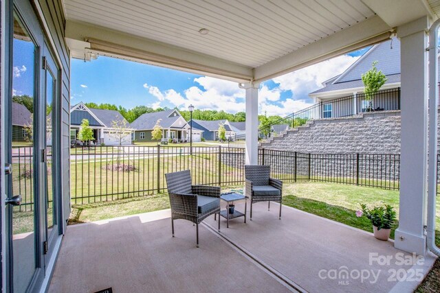 view of patio featuring a residential view