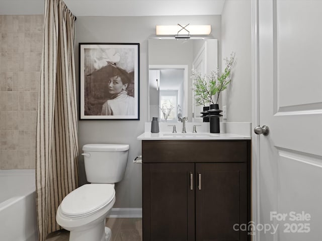 5517 Swaling St, Charlotte, NC 28217 - full bath with vanity, toilet, shower / tub combo with curtain, and baseboards