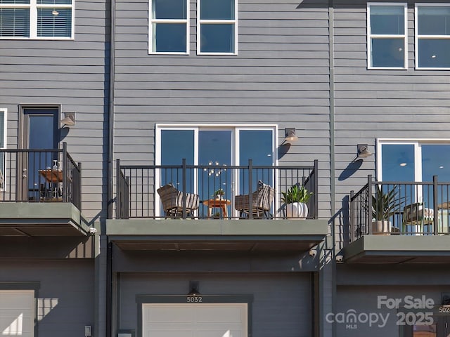 5517 Swaling St, Charlotte, NC 28217 - back of house with a balcony and an attached garage