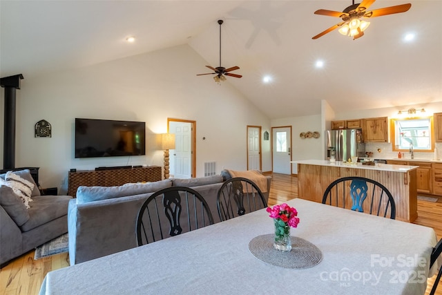 980 S River Rd, Sylva, NC 28779 - dining space with a ceiling fan, light wood-style flooring, high vaulted ceiling, healthy amount of natural light, and recessed lighting
