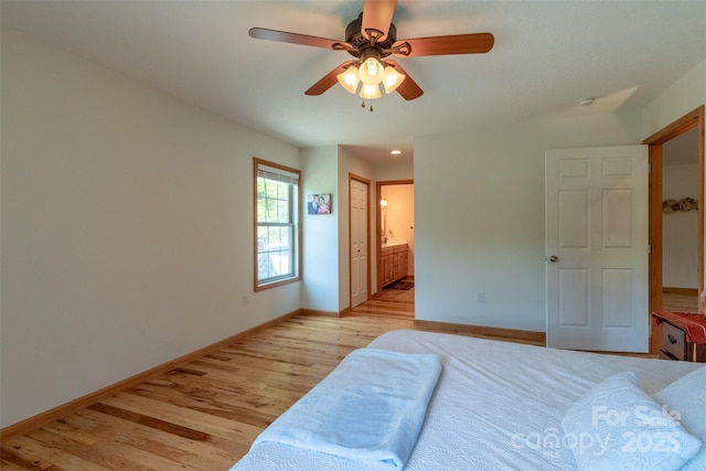 980 S River Rd, Sylva, NC 28779 - bedroom featuring light wood-style floors, ensuite bath, baseboards, and a ceiling fan
