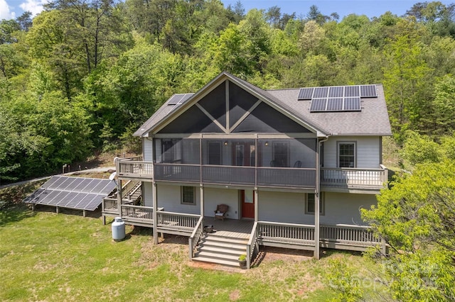 980 S River Rd, Sylva, NC 28779 - back of house with ground mounted solar panels, stairs, and roof with shingles
