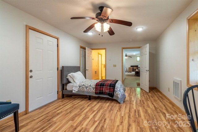 980 S River Rd, Sylva, NC 28779 - bedroom featuring light wood-style flooring, baseboards, and a ceiling fan