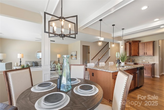 3211 Gilroy Dr, Fort Mill, SC 29707 - dining space with stairs, light wood finished floors, a chandelier, recessed lighting, and beamed ceiling