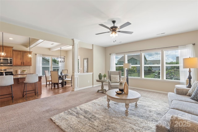 3211 Gilroy Dr, Fort Mill, SC 29707 - living room featuring healthy amount of natural light, baseboards, a ceiling fan, decorative columns, and beamed ceiling