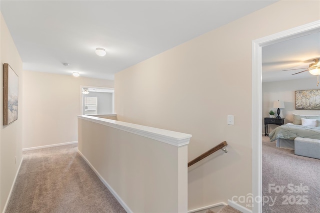 3211 Gilroy Dr, Fort Mill, SC 29707 - hallway with an upstairs landing, light colored carpet, and baseboards