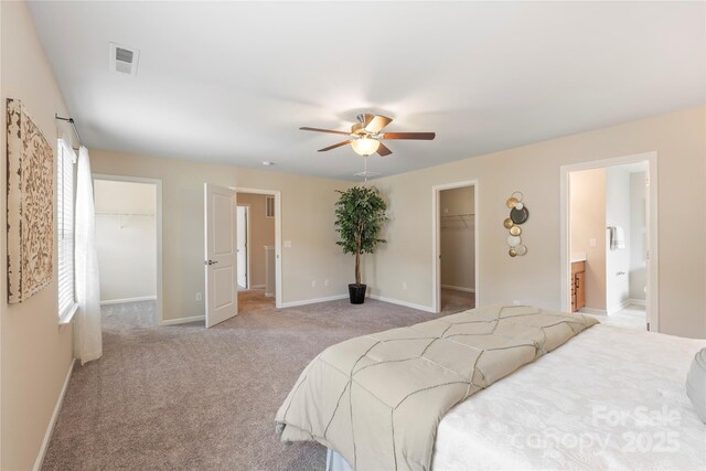 3211 Gilroy Dr, Fort Mill, SC 29707 - bedroom with a walk in closet, a closet, connected bathroom, and baseboards