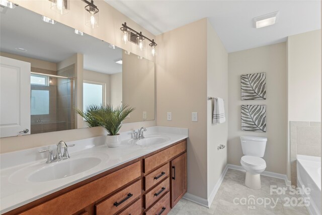 3211 Gilroy Dr, Fort Mill, SC 29707 - full bathroom featuring toilet, a bathtub, tiled shower, double vanity, and baseboards