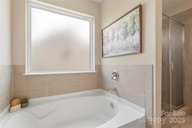 3211 Gilroy Dr, Fort Mill, SC 29707 - full bath featuring plenty of natural light, a shower stall, and a garden tub