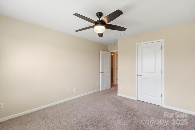 3211 Gilroy Dr, Fort Mill, SC 29707 - unfurnished bedroom with carpet, baseboards, and a ceiling fan