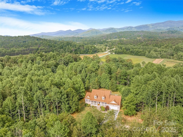 121 W Ashe Bridge Rd W, Marion, NC 28752 - aerial view of property and surrounding area with a heavily wooded area and mountains