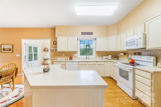 121 W Ashe Bridge Rd W, Marion, NC 28752 - kitchen with white appliances, a sink, light countertops, and plenty of natural light