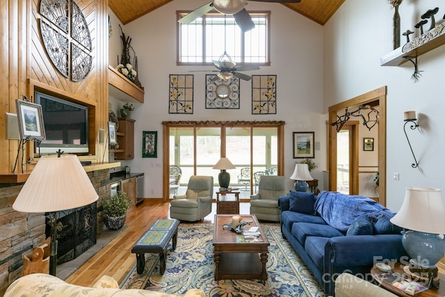 324 Austin Mountain Dr, Burnsville, NC 28714 - living area with a ceiling fan, high vaulted ceiling, light wood-style floors, and wooden ceiling