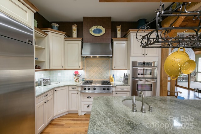 324 Austin Mountain Dr, Burnsville, NC 28714 - kitchen featuring stainless steel appliances, open shelves, light stone countertops, backsplash, and a sink