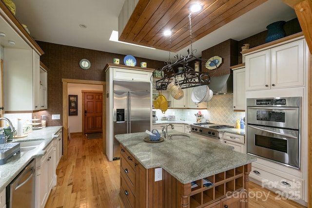 324 Austin Mountain Dr, Burnsville, NC 28714 - kitchen featuring appliances with stainless steel finishes, a sink, and light stone counters