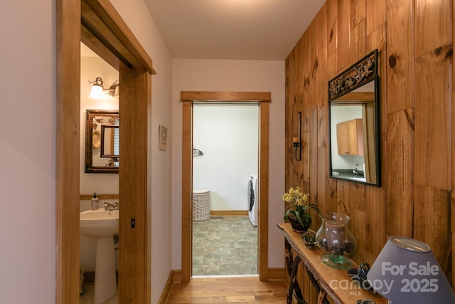 324 Austin Mountain Dr, Burnsville, NC 28714 - hallway featuring light wood-type flooring, a sink, and baseboards