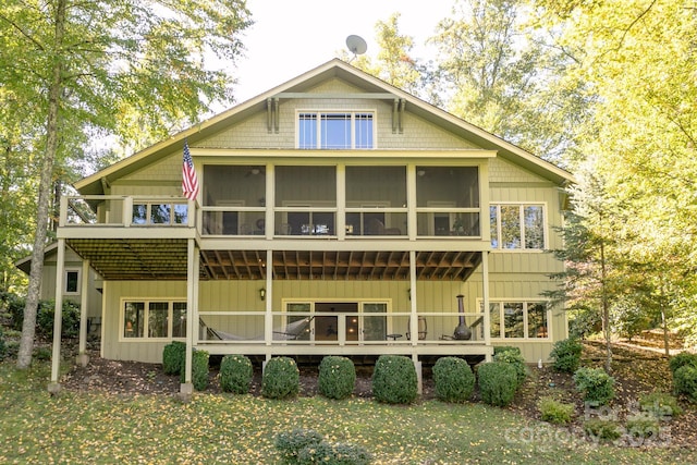 324 Austin Mountain Dr, Burnsville, NC 28714 - back of house featuring a sunroom and a wooden deck