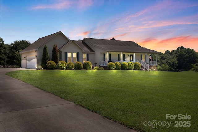 4916 Ritchie Rd, Lincolnton, NC 28092 - ranch-style house with covered porch, driveway, a yard, and an attached garage
