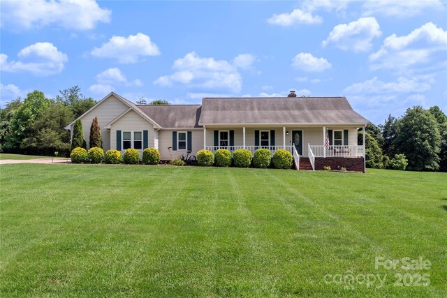 4916 Ritchie Rd, Lincolnton, NC 28092 - view of front of home featuring covered porch, a front lawn, and a chimney