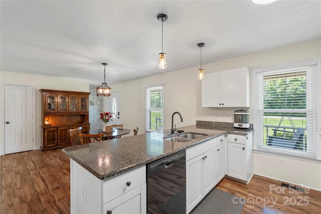 4916 Ritchie Rd, Lincolnton, NC 28092 - kitchen with black dishwasher, a peninsula, a sink, white cabinetry, and wood finished floors