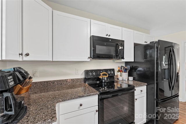4916 Ritchie Rd, Lincolnton, NC 28092 - kitchen with black appliances, white cabinets, and dark stone countertops