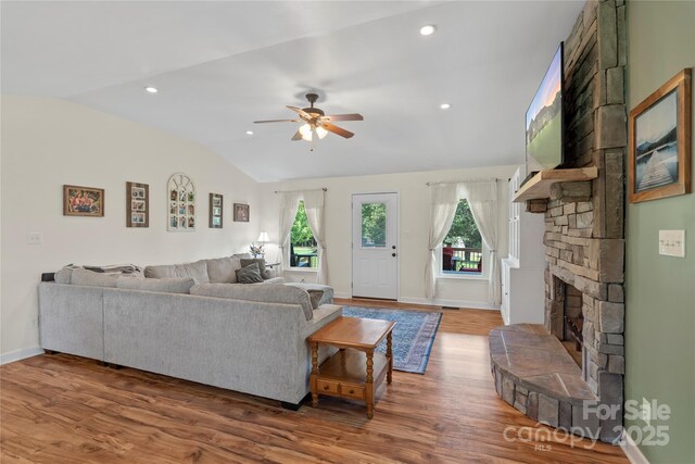 4916 Ritchie Rd, Lincolnton, NC 28092 - living area with lofted ceiling, ceiling fan, wood finished floors, baseboards, and a stone fireplace