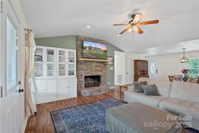 4916 Ritchie Rd, Lincolnton, NC 28092 - living room featuring vaulted ceiling, wood finished floors, ceiling fan, and a fireplace