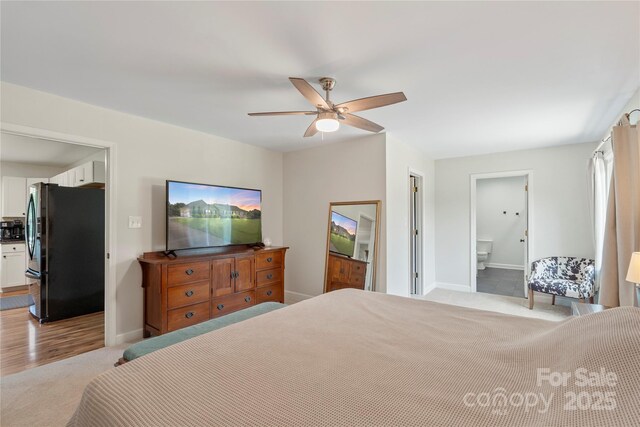 4916 Ritchie Rd, Lincolnton, NC 28092 - bedroom with freestanding refrigerator, baseboards, carpet flooring, and ensuite bath