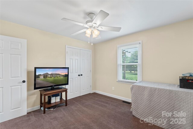 4916 Ritchie Rd, Lincolnton, NC 28092 - living area featuring dark colored carpet, ceiling fan, and baseboards
