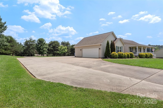 4916 Ritchie Rd, Lincolnton, NC 28092 - view of property exterior featuring driveway, a yard, a garage, and a porch