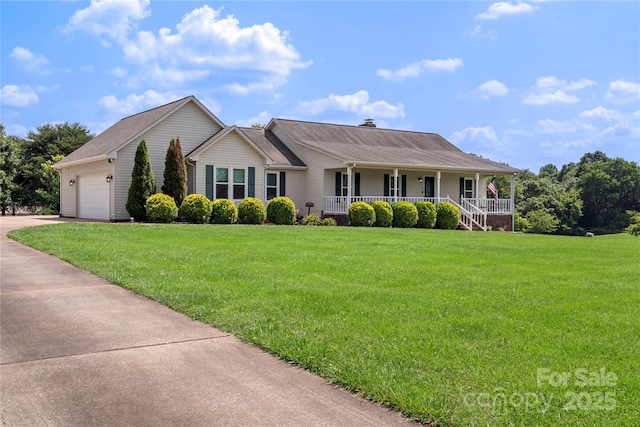 4916 Ritchie Rd, Lincolnton, NC 28092 - view of front facade with a porch, a front lawn, concrete driveway, and a garage