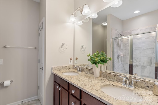 4313 Courtly Ln, Belmont, NC 28012 - bathroom featuring a stall shower, double vanity, and baseboards