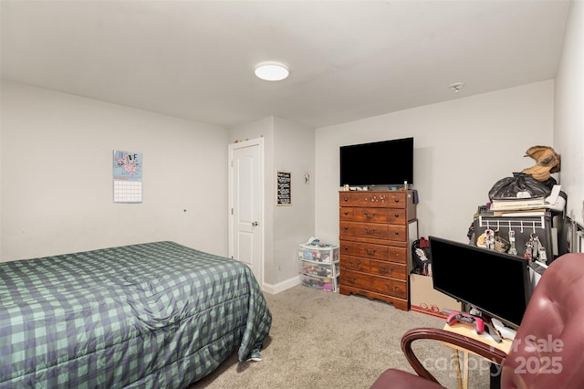 carpeted bedroom with baseboards