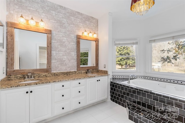 4001 Carmel Acres Dr, Charlotte, NC 28226 - bathroom with tile patterned floors, double vanity, a relaxing tiled tub, and brick wall
