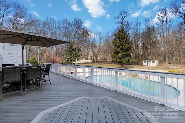 4001 Carmel Acres Dr, Charlotte, NC 28226 - wooden deck featuring a storage shed, an outbuilding, and outdoor dining area