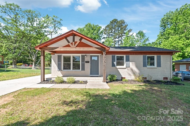 view of front facade with brick siding, covered porch, and crawl space
