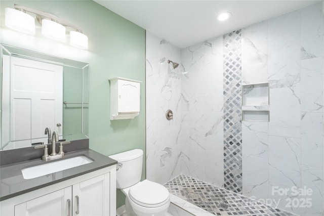 full bath with toilet, a marble finish shower, vanity, and recessed lighting