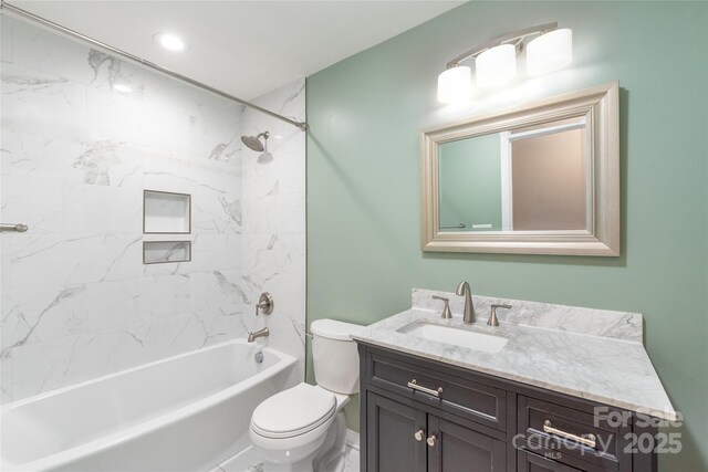 full bath featuring toilet, vanity, and bathtub / shower combination