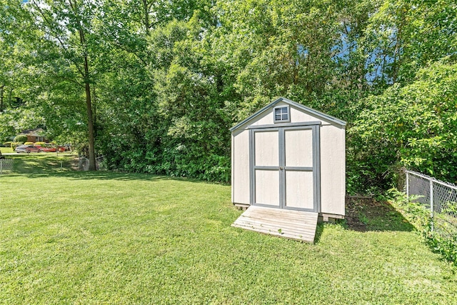 view of shed featuring view of wooded area