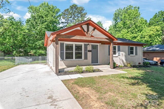 view of front of property with brick siding and driveway