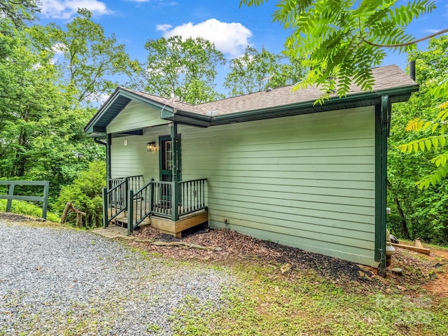 view of front of house with a shingled roof